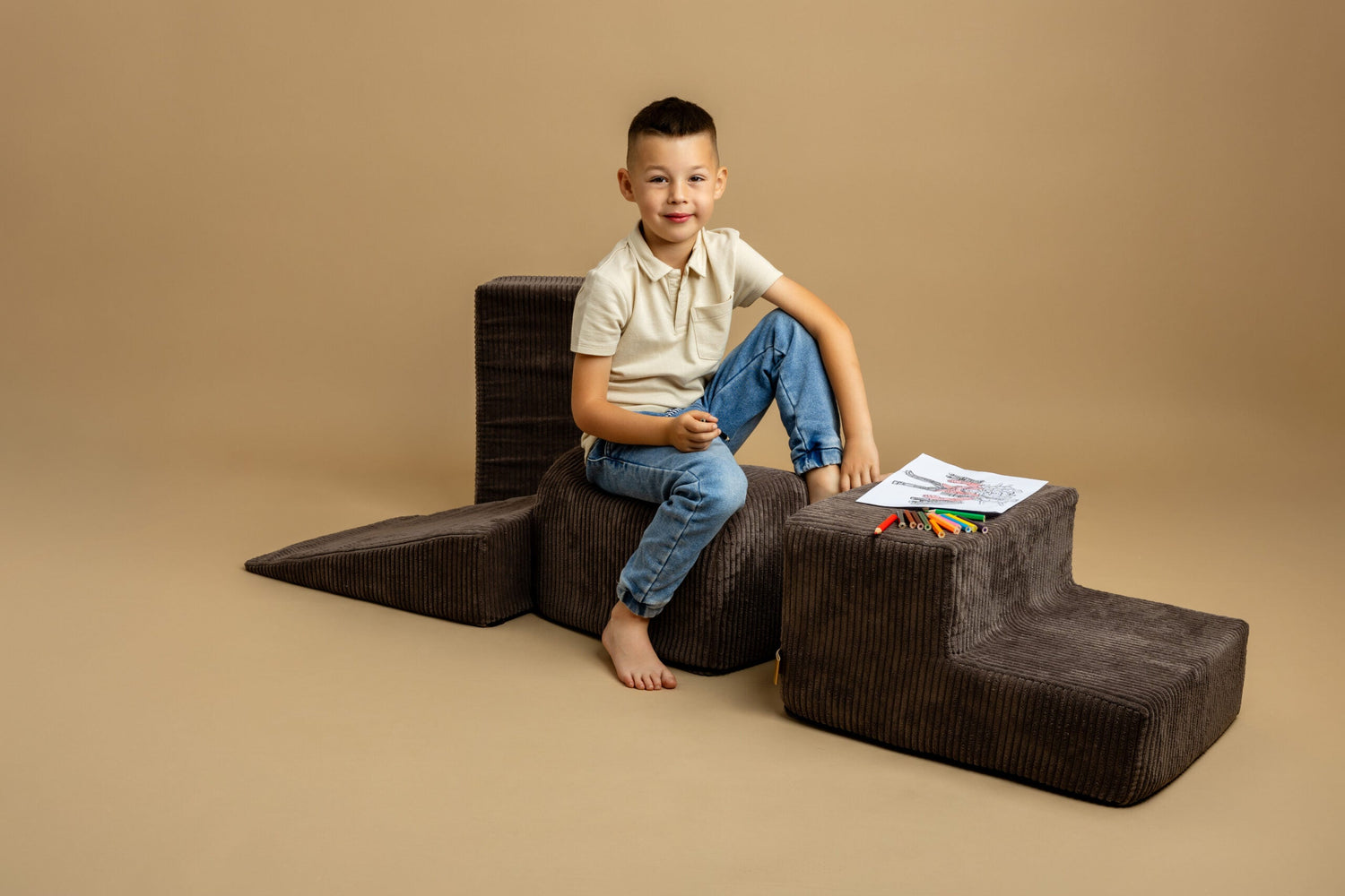 Boy sitting on brown 5 piece soft velvet Meowbaby poligon