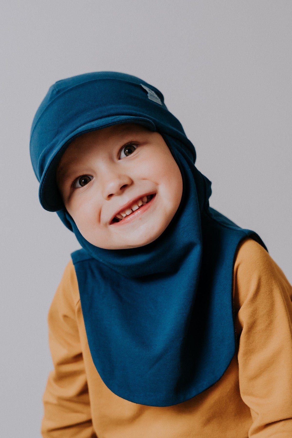 a boy with blue breden balaclava for winter