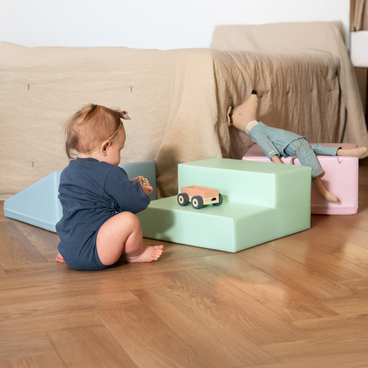 a kid playing with iglu soft play pastel set